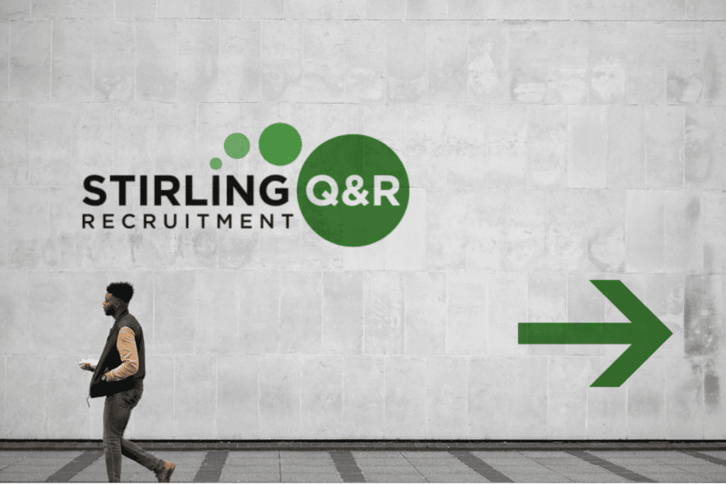 Stirling Q&R logo painted on a wall with a green arrow